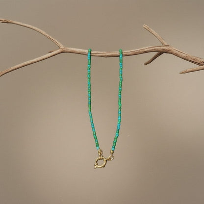 Aramat Jewels beaded necklace with blue and green seed beads and a gold-tone clasp.