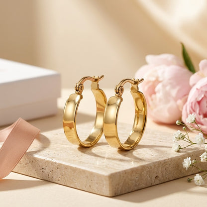 Aramat Jewels gold-tone stainless steel smooth hoop earrings, 16mm diameter, with hinge clasp.