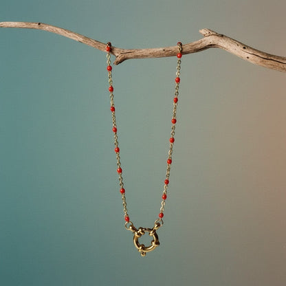 Aramat Jewels gold chain necklace with small red enamel beads and a large gold clasp.