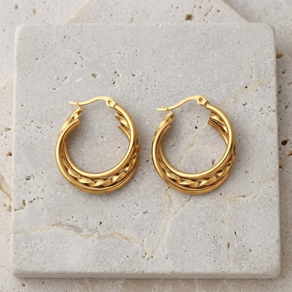 Aramat Jewels gold-tone triple hoop earrings, featuring two smooth rings and one twisted ring, 30x7.5mm.