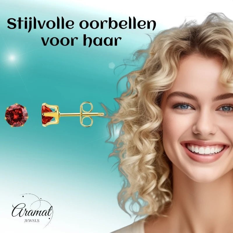Aramat Jewels goudkleurige RVS oorstekers met rode zirkonia, 3 mm diameter, subtiel en elegant.