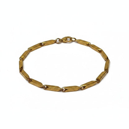 Aramat Jewels goudkleurige RVS schakelarmband met Grieks motief, 3mm breed, gemaakt van duurzaam 316L staal.