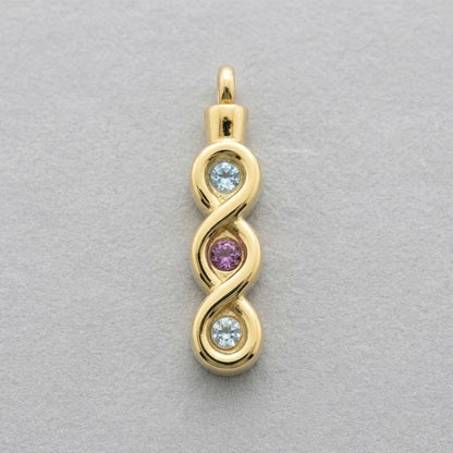 Aramat Jewels® goudkleurige stalen ashanger met infinity design en drie zirkonia's: twee lichtblauw en één roze.