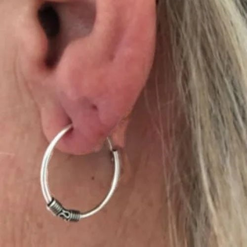 Aramat Jewels 18mm oxidized silver Bali hoop earrings with intricate detailing.
