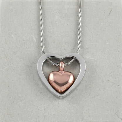 Aramat Jewels stalen hart crematiehanger in zilverkleurig en rosékleurig. Gedenksieraad met schroefsluiting, zonder ketting.