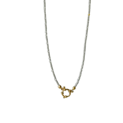 Aramat Jewels handmade necklace with white and transparent Rocailles beads and gold clasp. Elegant and pure design.