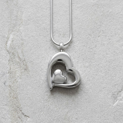 Aramat Jewels® zilverkleurige stalen ashanger in hartvorm met een kleiner hartje erin. Zonder ketting.
