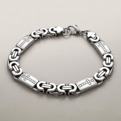 Aramat Jewels zilverkleurige koningsschakel armband van staal met kruisjes, 9mm breed en 21cm lang.