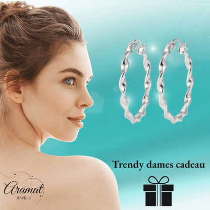 Aramat Jewels silver twisted hoop earrings, 40mm diameter, high gloss finish, elegant statement jewelry for women.