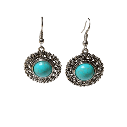 Paar sierlijke zilveren oorbellen met turquoise stenen in ronde zettingen.