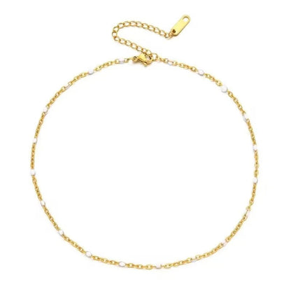 De gouden schakelarmband met parels