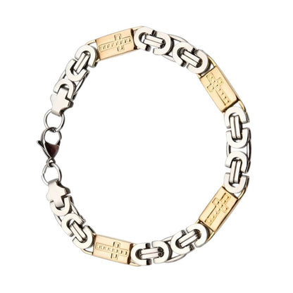 Een armband met tweekleurige gouden en zilveren schakels