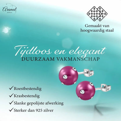 Paar roze pareloorbellen met kristallen.