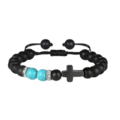 Een zwarte armband met turquoise kralen en een zilveren sluiting